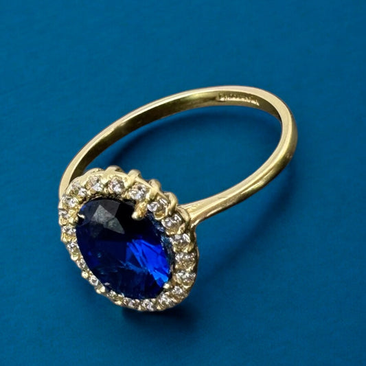 ANILLO CON UNA PIEDRA OVALADA AZUL EN ORO MEXICANO 10 K