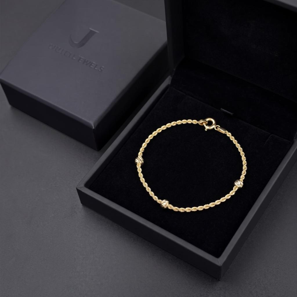PULSO TORSAL CON BOLITAS EN ORO 14 K